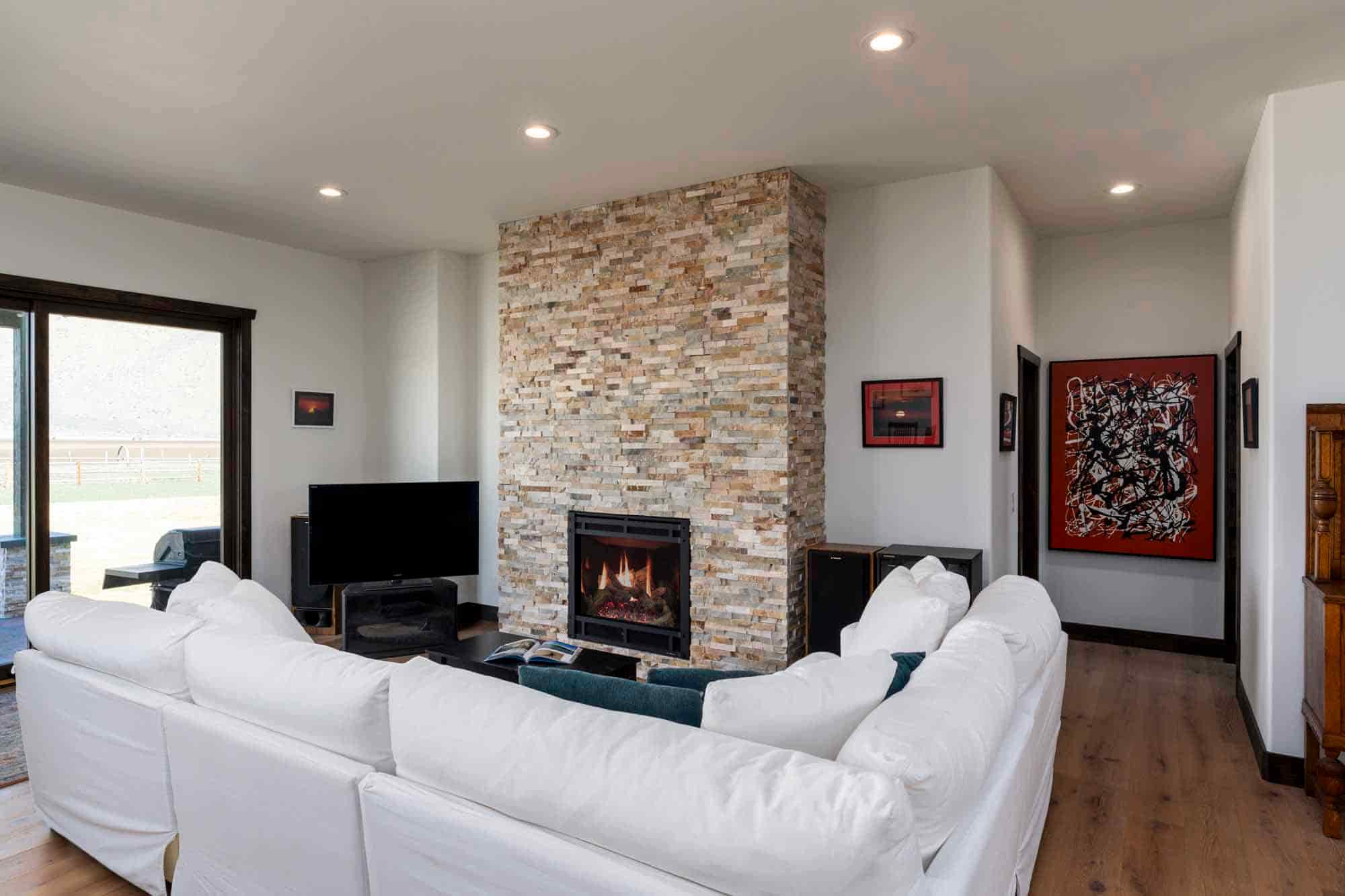 The living room's vaulted ceilings and abundant light creates a stunning impression upon entry